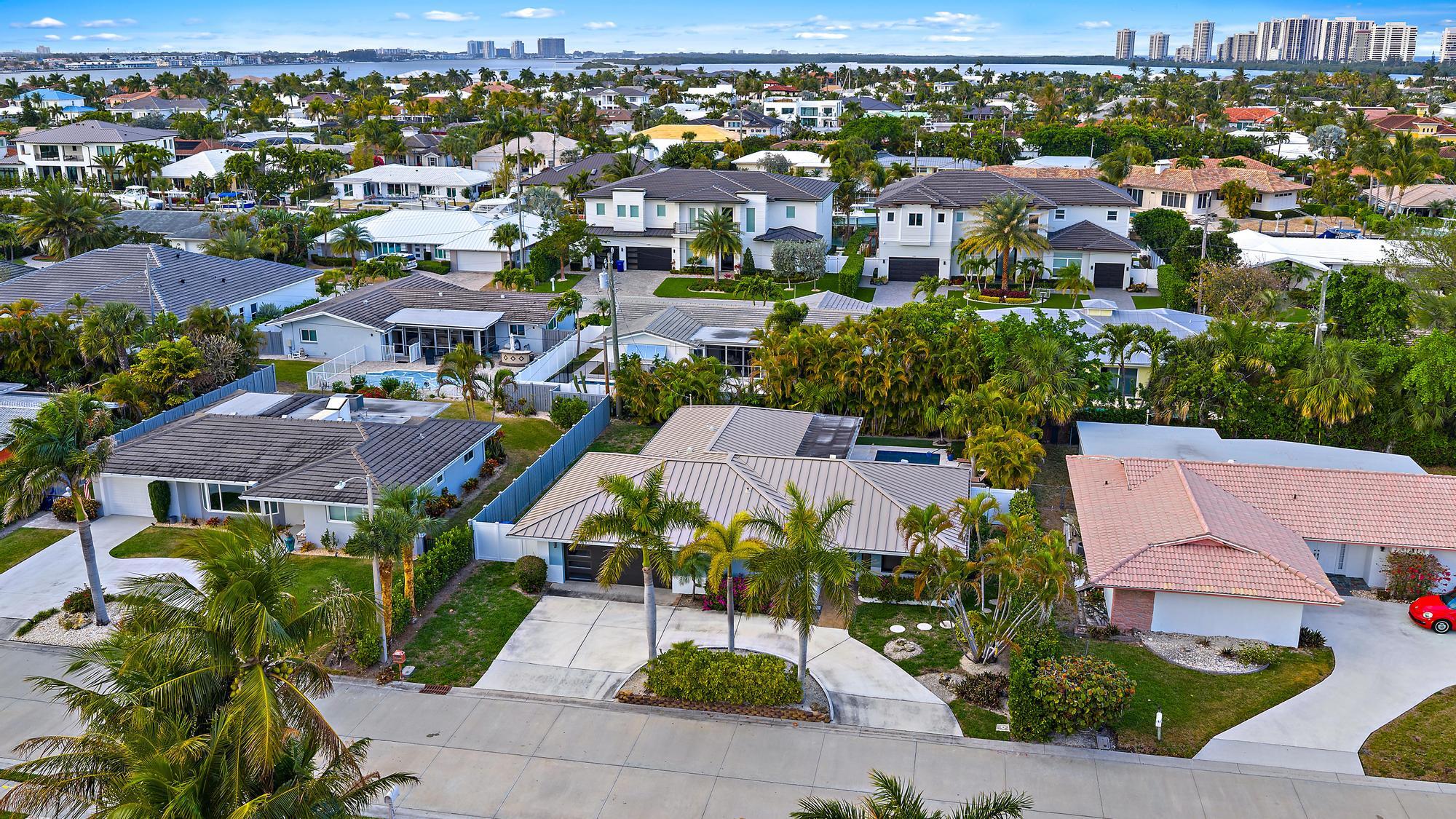 1120 Singer Drive Riviera Beach, FL 33404 - Photo 33 of 37 an aerial view of residential houses with outdoor space