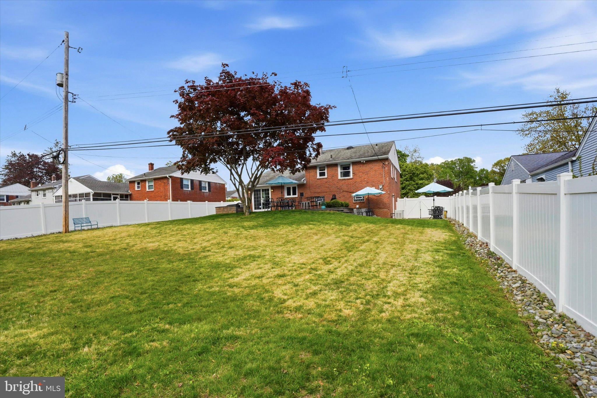 308 Lewis Road Springfield, PA 19064 - Photo 34 of 34 Spacious yard with vibrant greenery.