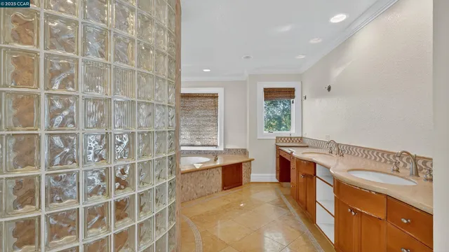 a bathroom with a tub shower and a sink