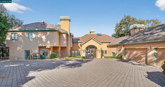a view of the house with a yard