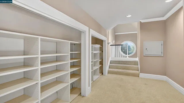 a view of an empty room and bathroom