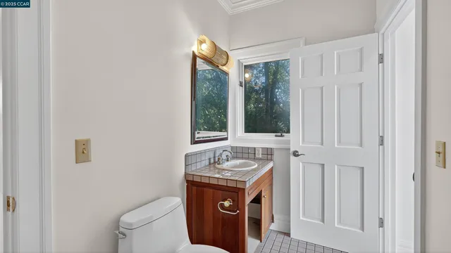 a view of a kitchen with wooden floor and cabinet
