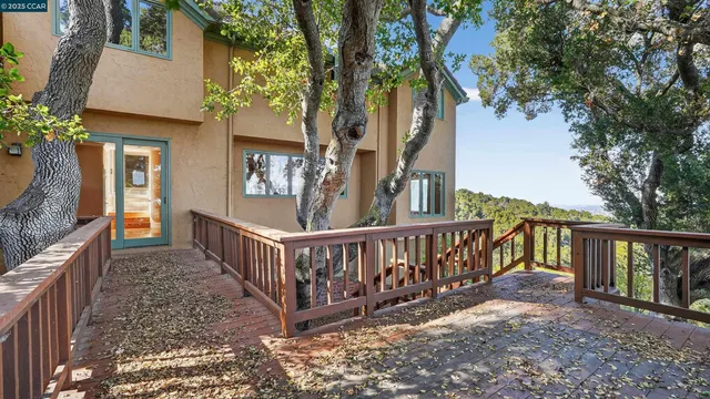 a view of a deck with wooden floor and fence