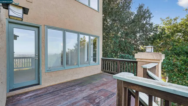 a view of a house with a mountain and a forest
