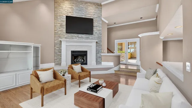 a living room with a fireplace and a flat screen tv