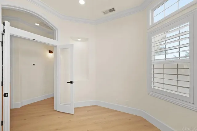a kitchen with stainless steel appliances a white cabinet and a stove top oven