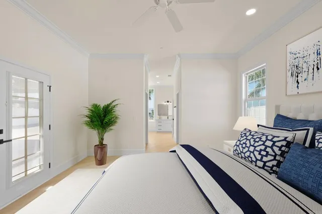 a large white kitchen with a large window