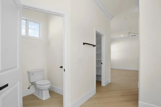 a view of a patio with couches table and chairs and potted plants