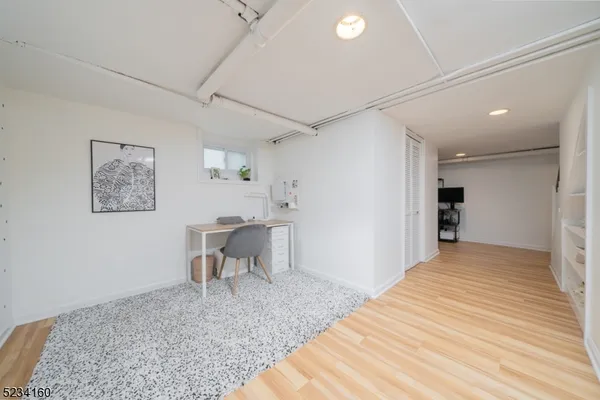 a view of a livingroom with furniture and wooden floor