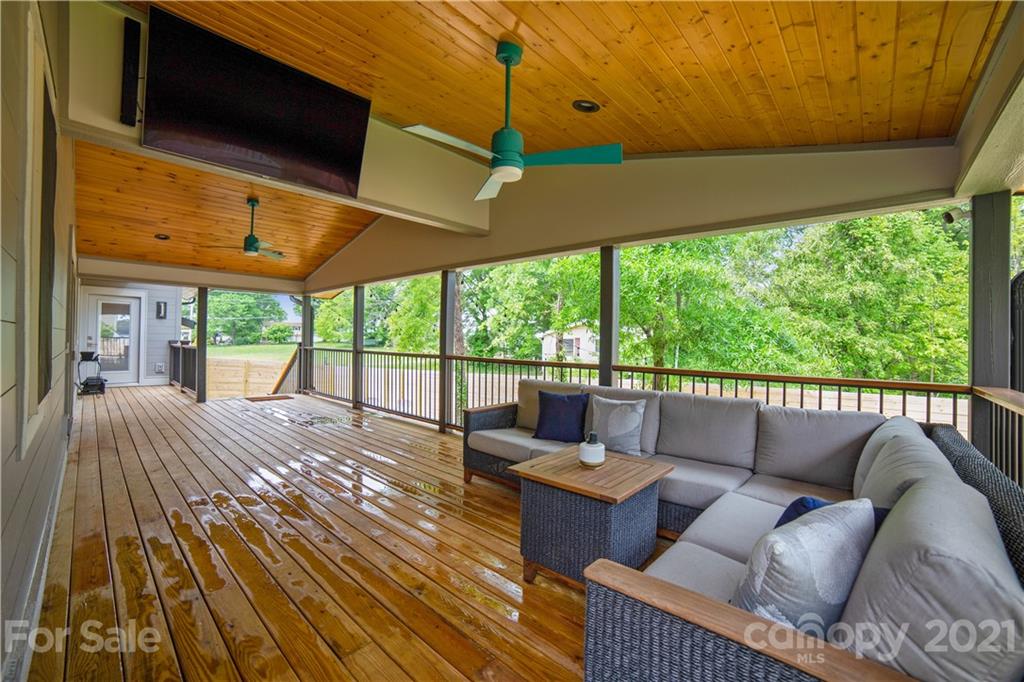 5016 Kiser Island Road Terrell, NC 28682 - Photo 11 of 37 a balcony with furniture and a fireplace