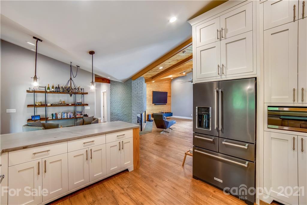5016 Kiser Island Road Terrell, NC 28682 - Photo 17 of 37 a kitchen with kitchen island white cabinets and stainless steel appliances