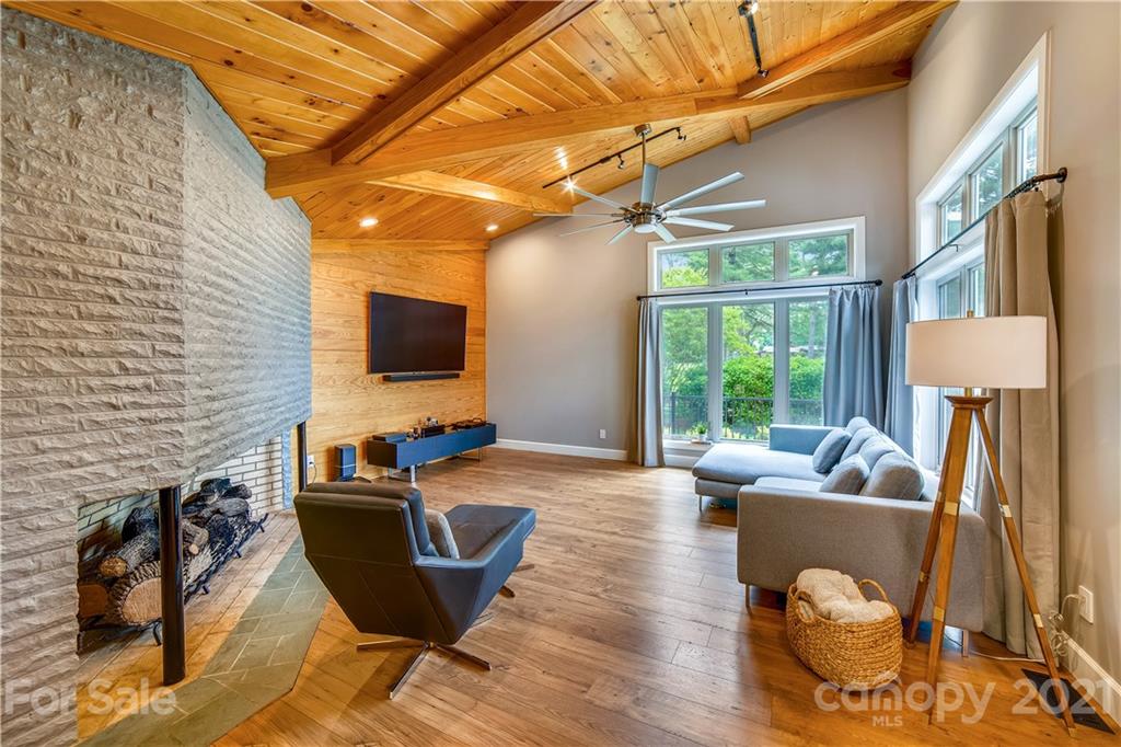 5016 Kiser Island Road Terrell, NC 28682 - Photo 24 of 37 a living room with couches a flat screen tv and a large window with outer view