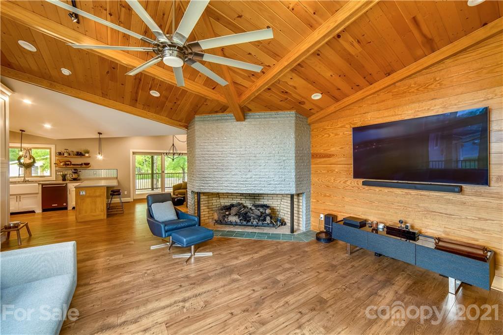 5016 Kiser Island Road Terrell, NC 28682 - Photo 25 of 37 a living room with fireplace furniture and a flat screen tv