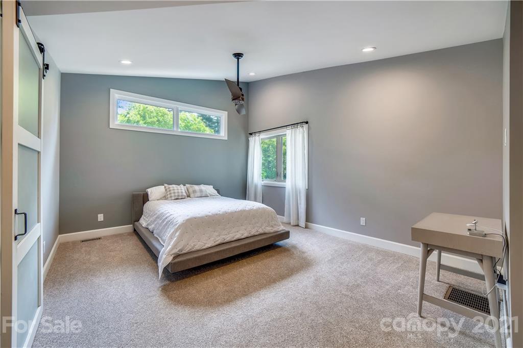 5016 Kiser Island Road Terrell, NC 28682 - Photo 27 of 37 a bedroom with a bed and a chair