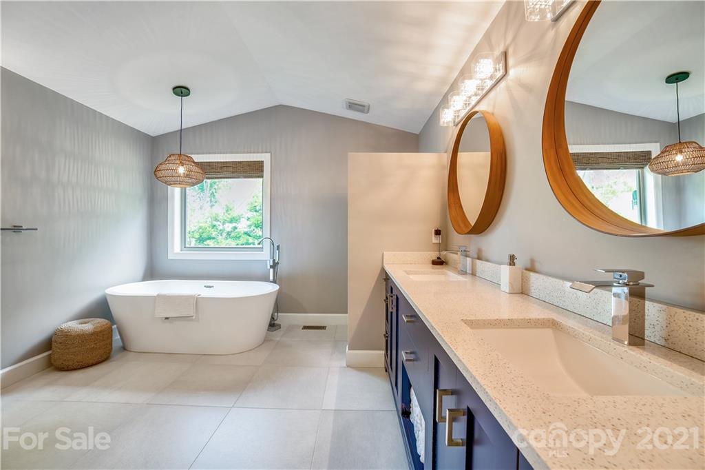 5016 Kiser Island Road Terrell, NC 28682 - Photo 29 of 37 a bathroom with a granite countertop sink and a mirror