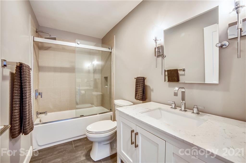 5016 Kiser Island Road Terrell, NC 28682 - Photo 31 of 37 a bathroom with a granite countertop sink toilet and shower