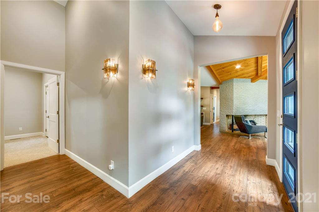 5016 Kiser Island Road Terrell, NC 28682 - Photo 34 of 37 a view of a hallway view with dining room and wooden floor