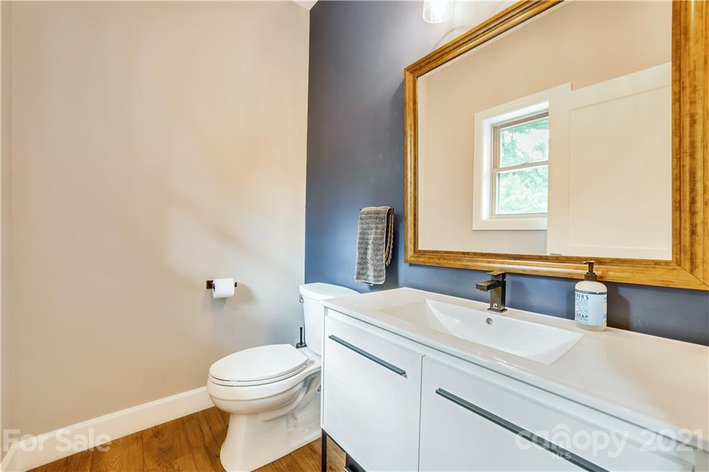 5016 Kiser Island Road Terrell, NC 28682 - Photo 35 of 37 a bathroom with a sink a toilet and a mirror