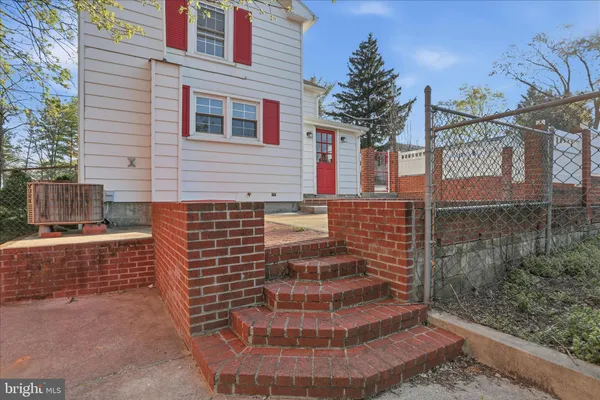 a view of a brick house with many windows