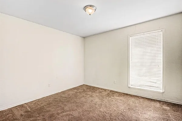 a view of a room that has a window in it