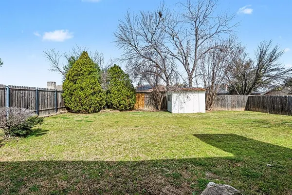 a view of a back yard of the house