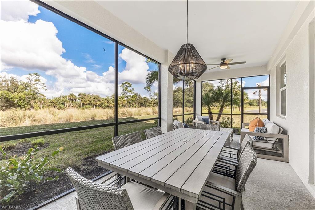 a view of a dining room with furniture window and outside view
