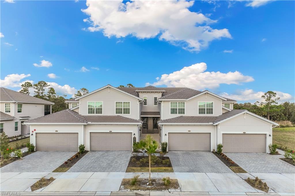 43333 Water Bird Way, Unit 4812 Babcock Ranch, FL 33982 - Photo 17 of 19 a front view of a house with garden