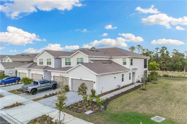 a view of a house with a big yard