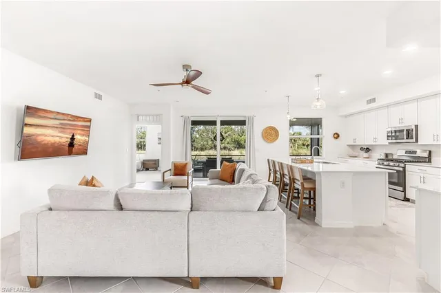 a living room with furniture and a window