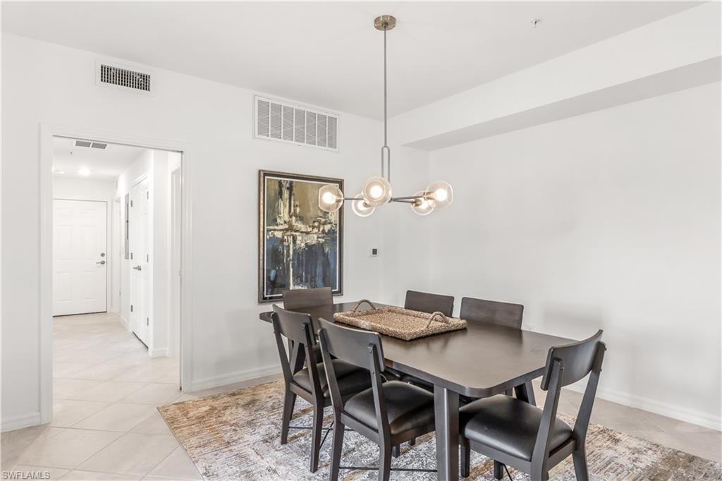 43333 Water Bird Way, Unit 4812 Babcock Ranch, FL 33982 - Photo 7 of 19 a view of a dining room with a table and chairs