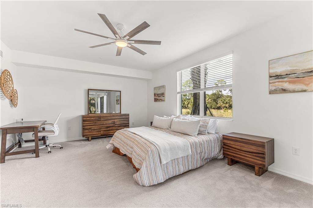 43333 Water Bird Way, Unit 4812 Babcock Ranch, FL 33982 - Photo 10 of 19 a bedroom with a bed furniture and a window