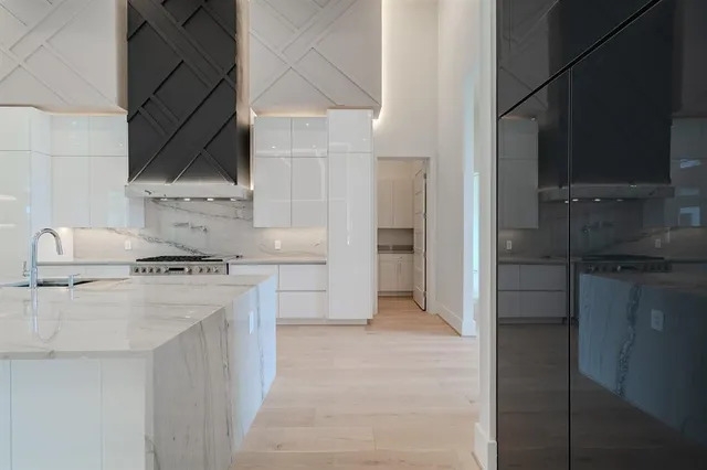 a kitchen with a stove and a refrigerator
