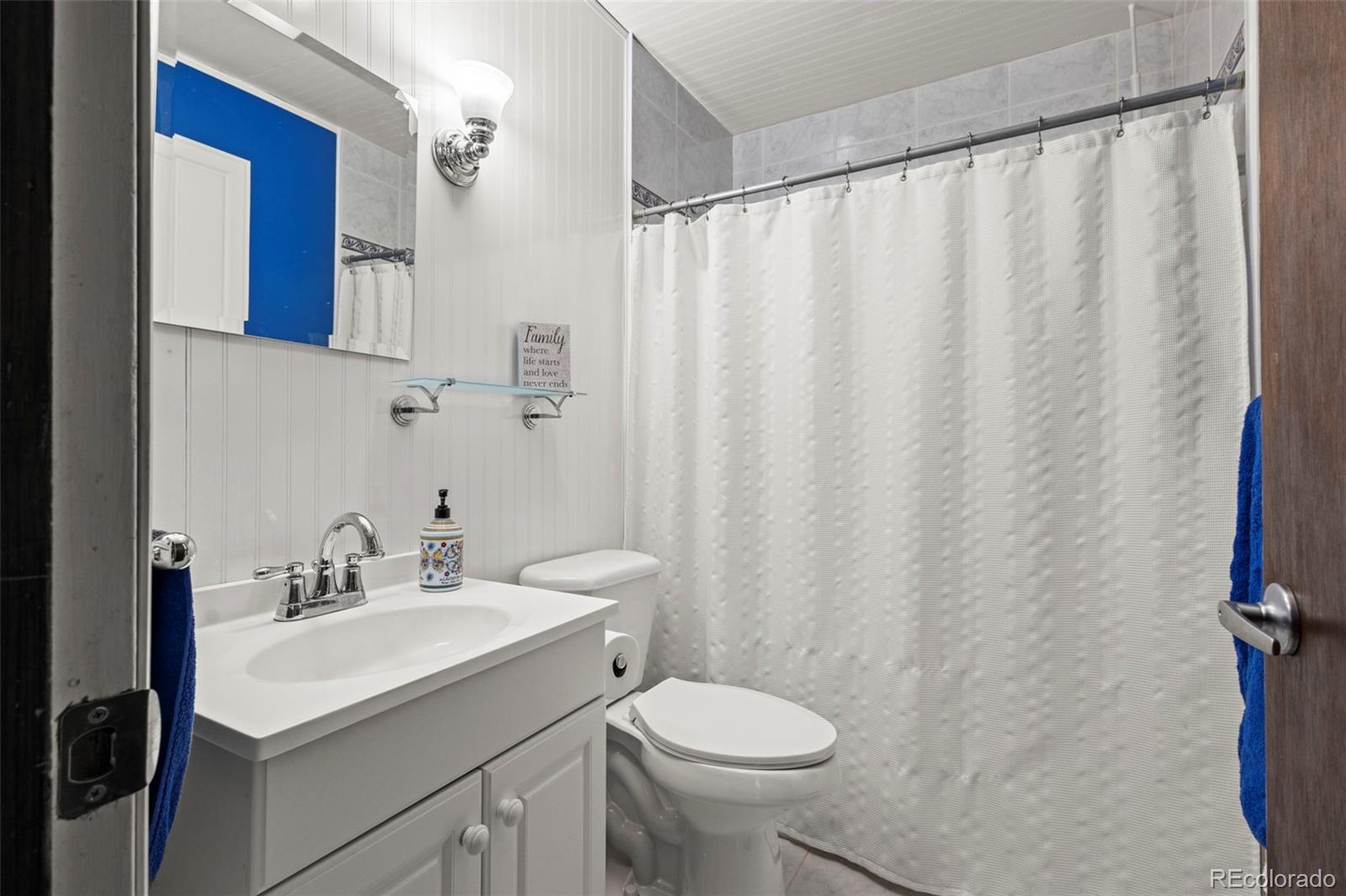 360 Gcr 194 Kremmling, CO 80459 - Photo 30 of 50 a bathroom with a sink a toilet and shower curtain