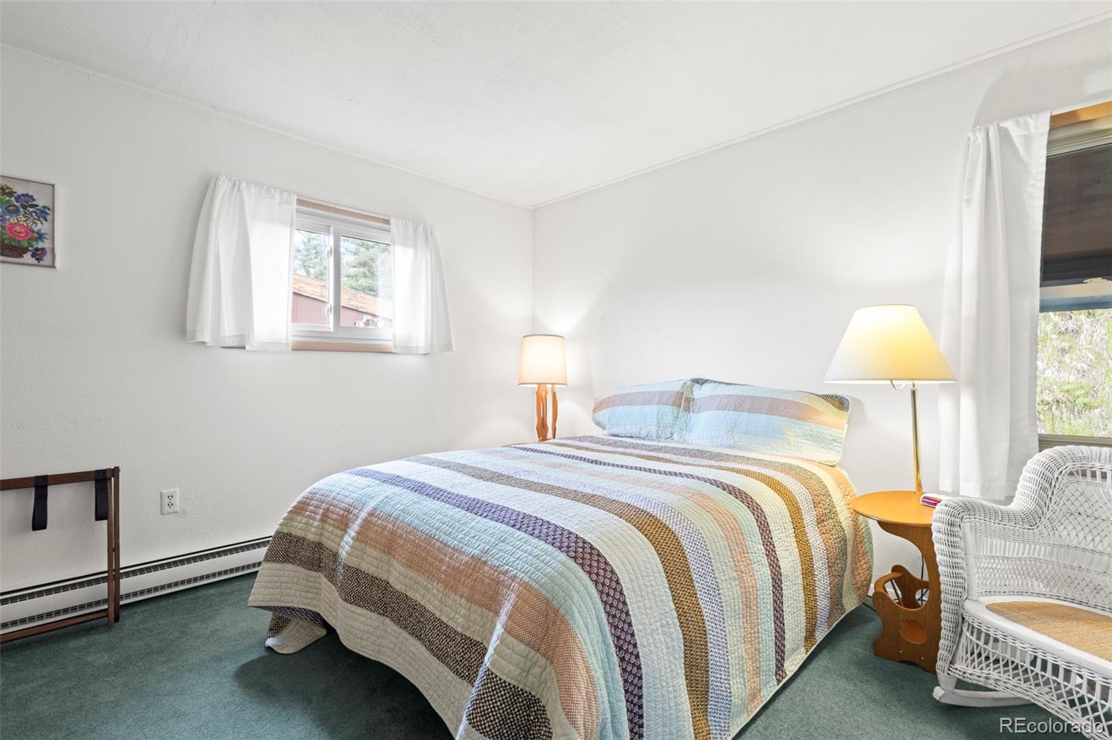 360 Gcr 194 Kremmling, CO 80459 - Photo 33 of 50 a bedroom with a bed and a lamp