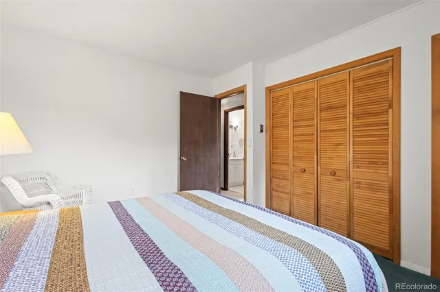 a view of a livingroom with furniture and an empty room