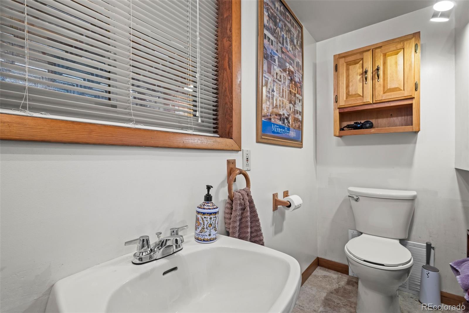 360 Gcr 194 Kremmling, CO 80459 - Photo 45 of 50 a bathroom with a toilet sink and mirror