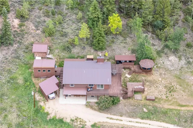 an aerial view of a house with outdoor space and street view