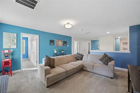 a living room with furniture and a couch