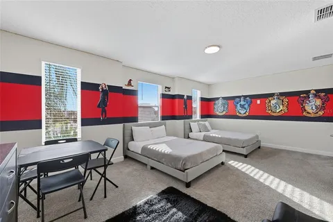 a living room with furniture and a rug