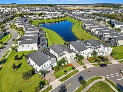 an aerial view of residential houses with outdoor space