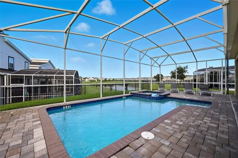 a view of a swimming pool with a lounge chair