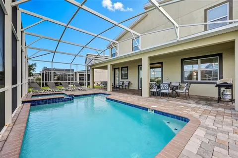a view of swimming pool with outdoor seating