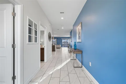 a view of a living room with a fireplace