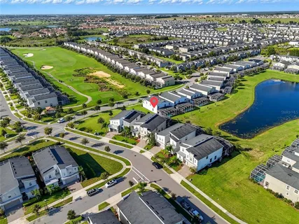 an aerial view of residential houses with outdoor space