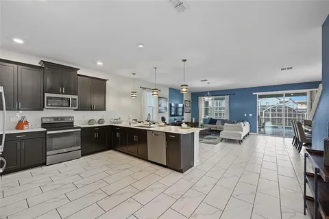 a large white kitchen with lots of counter top space