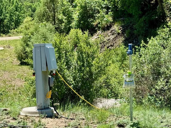 a wooden fence with some trees in the background