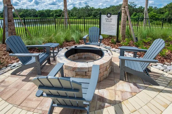 a view of a chairs and table in the garden