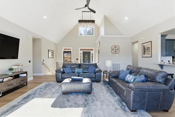 a large kitchen with stainless steel appliances kitchen island granite countertop a large counter top and stove top oven