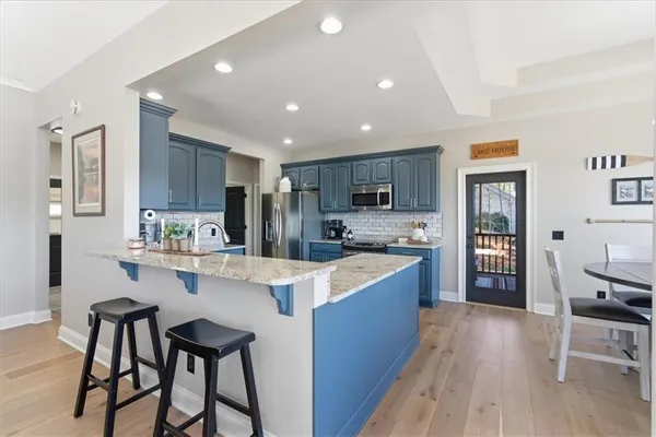 a utility room with sink dryer and washer