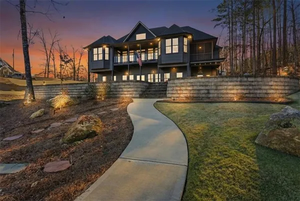 a large kitchen with stainless steel appliances granite countertop a stove a refrigerator a oven with a dining table and chairs